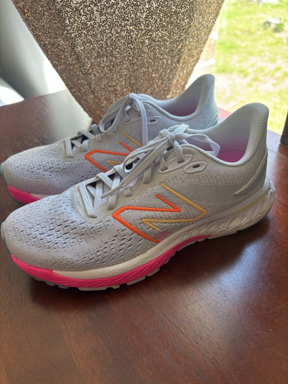 New Balance Women's Light Gray Running Sneakers with Pink and Orange Accents